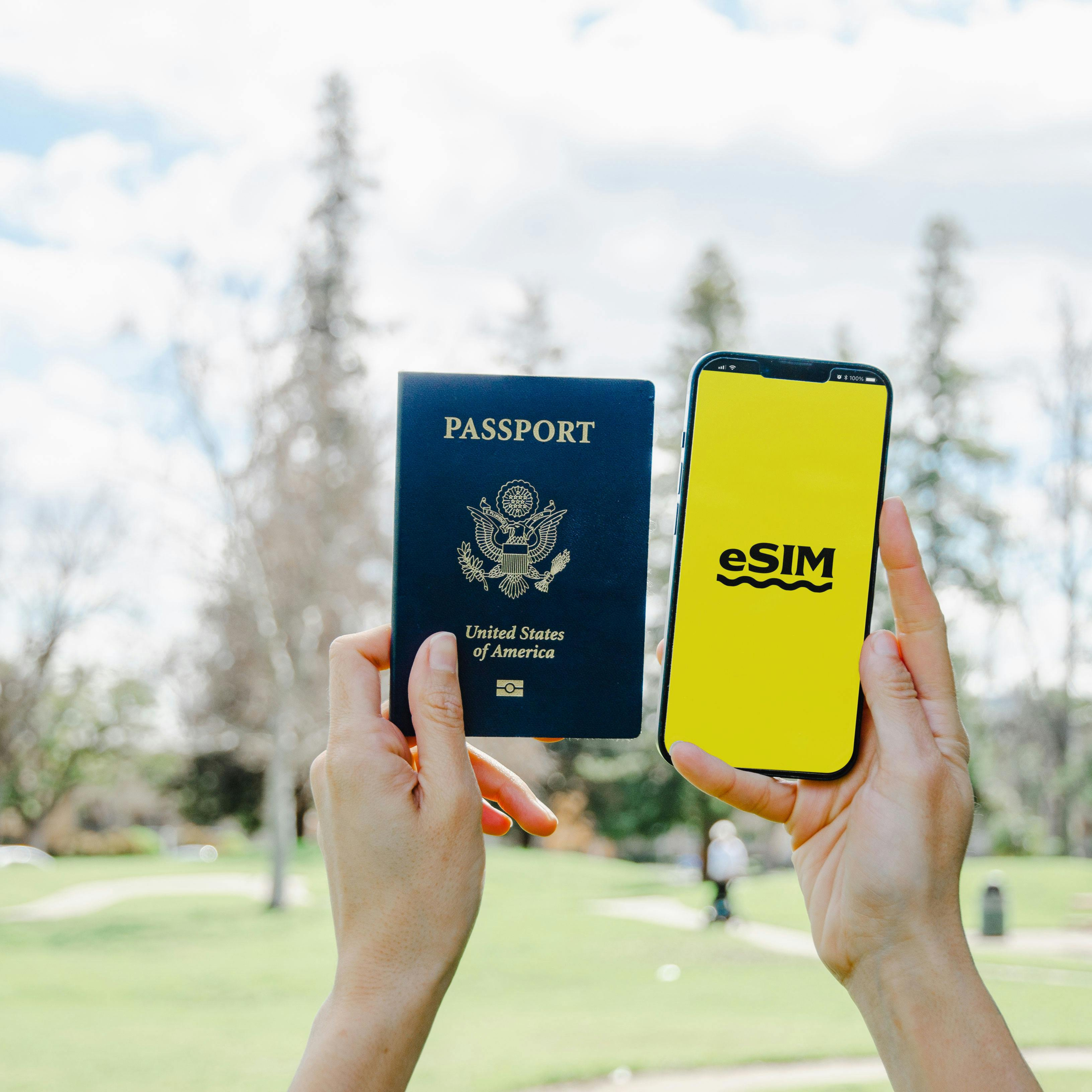 esim phone and passport in hands